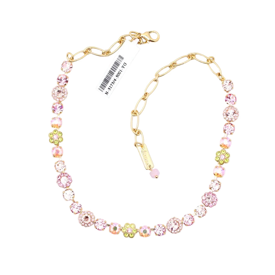 Necklace with pastel-colored beads and gold chain on a white background