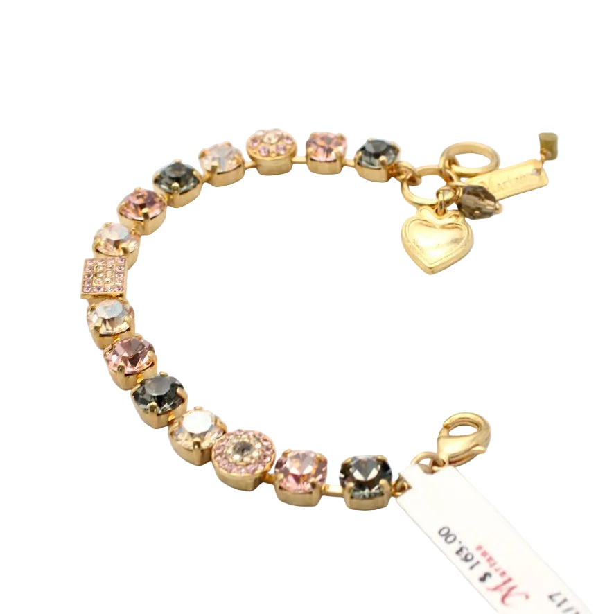 Gold bracelet with colorful gemstones on a white background