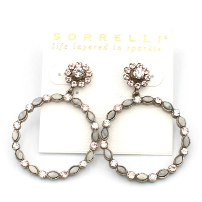 Pair of hoop earrings with decorative elements on a white background, featuring the brand 'Sorrelli'.