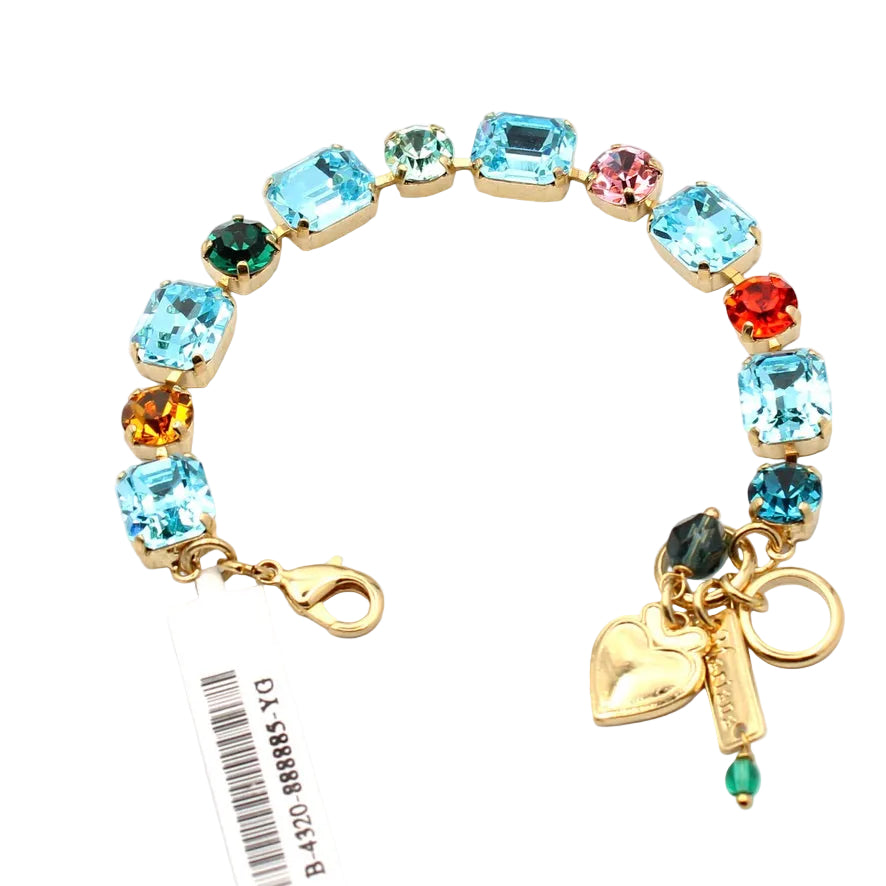 Multicolored gemstone bracelet with heart charm and tag on a white background