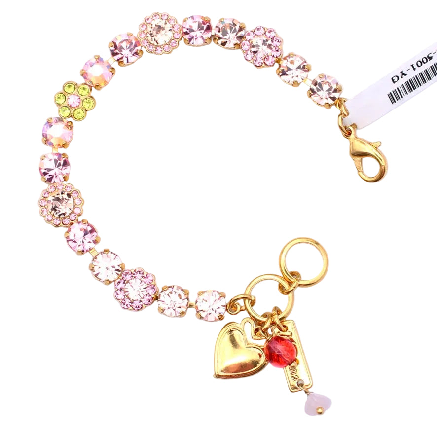 Bracelet with colorful crystals and gold heart charm on a white background