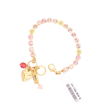 Colorful bracelet with charms on a white background