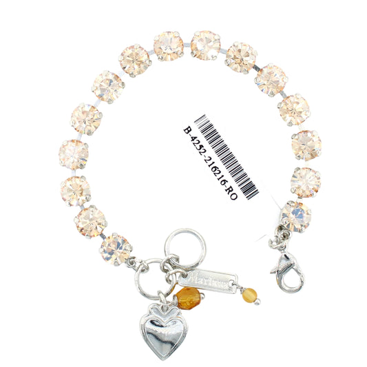 Bracelet with heart charm and Swarovski crystals on a white background