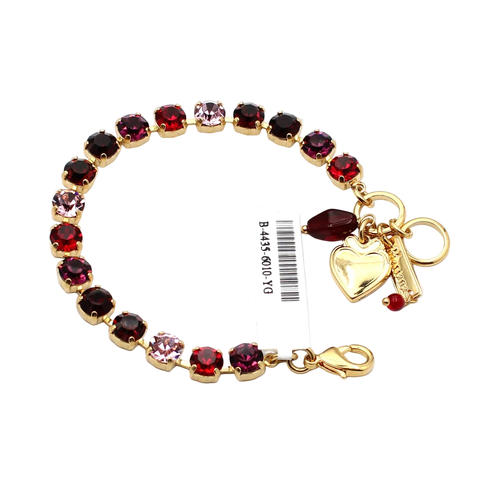 Gold bracelet with red and pink gemstones and heart charm on a white background