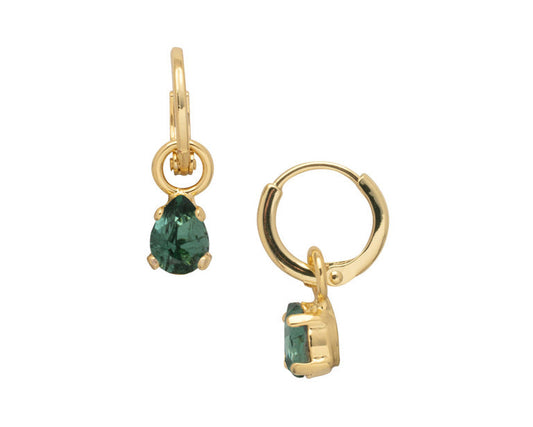 Gold hoop earrings with green gemstones on a white background