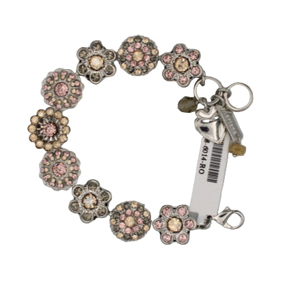 Bracelet with floral charms and a tag on a gray background