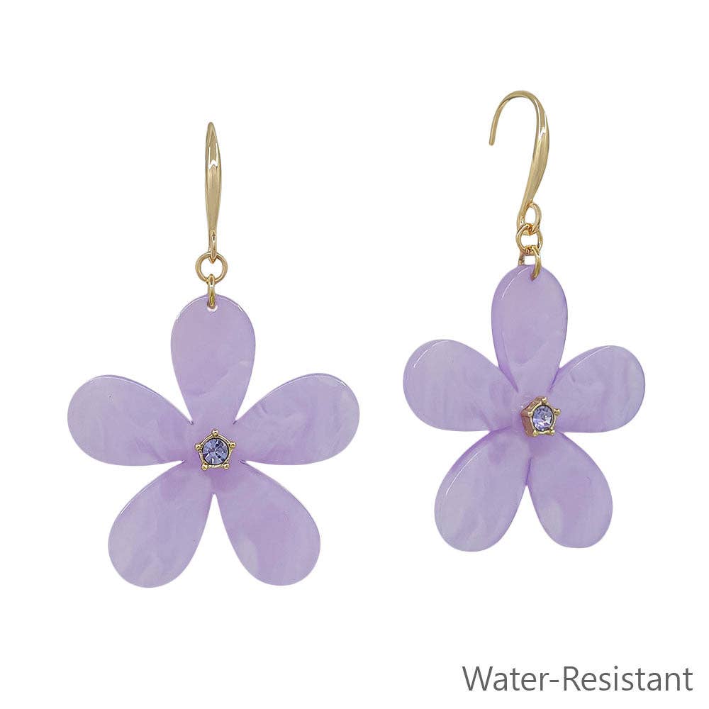 Purple flower-shaped earrings with gold hooks on a white background