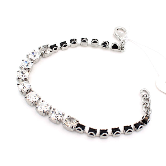 Silver bracelet with clear gemstones on a white background