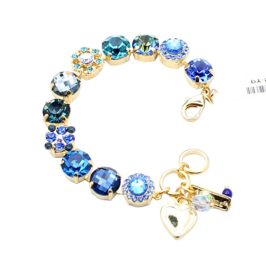 Jewelry bracelet with blue gemstones and gold accents on a white background