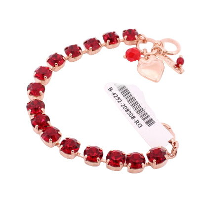 Bracelet with red beads and gold accents on a white background