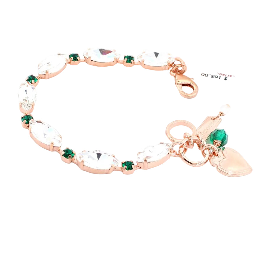 Rose gold bracelet with green and clear gemstones on a white background