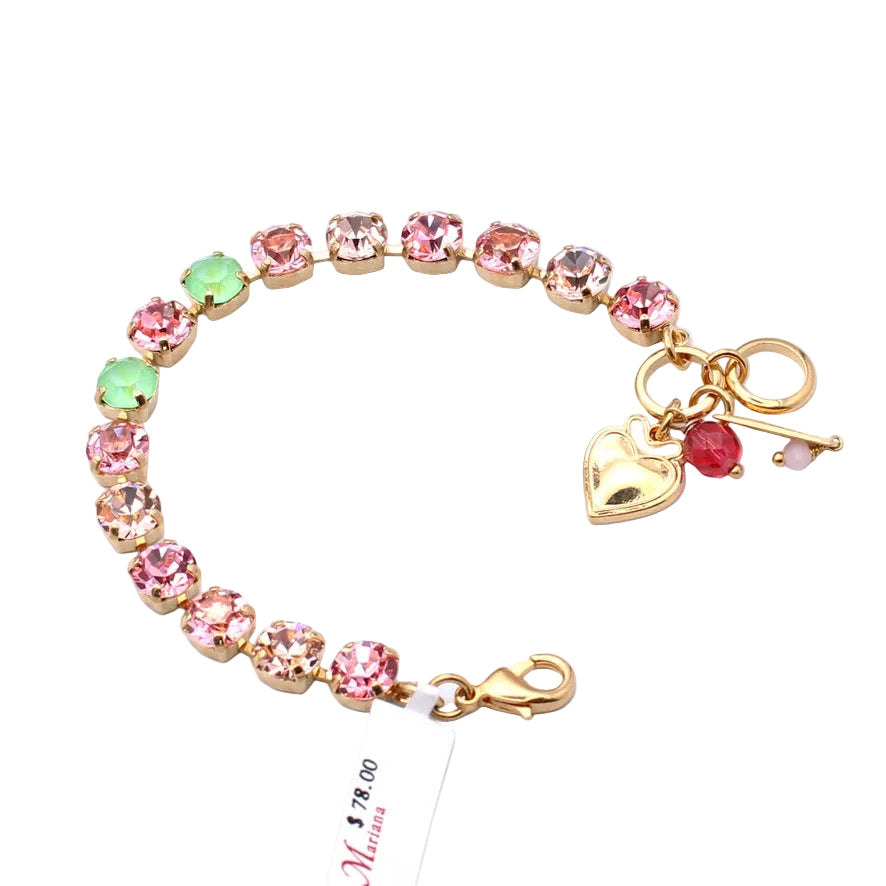 Bracelet with pink and green gemstones and a heart charm on a white background