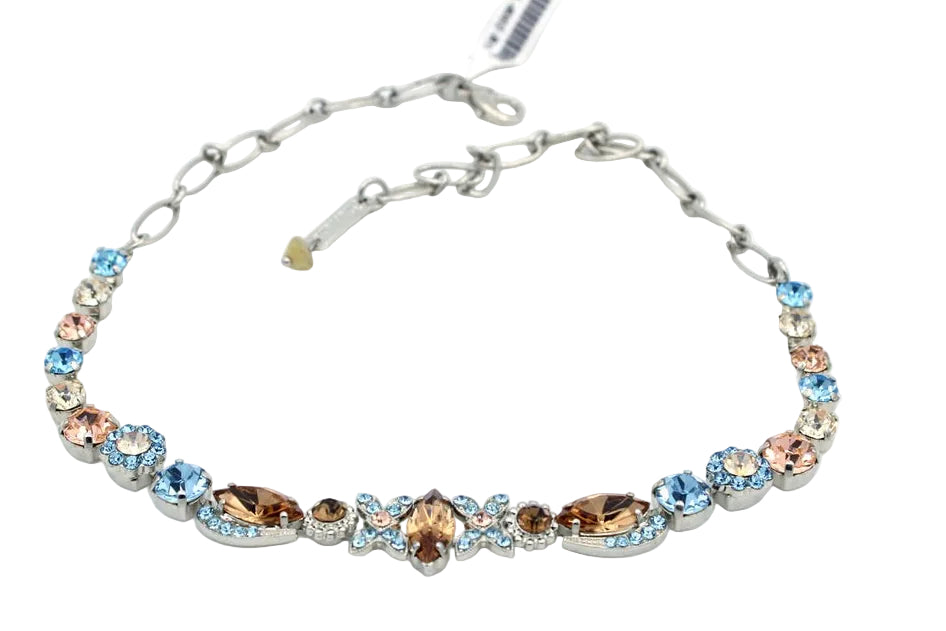 Necklace with multicolored gemstones on a white background