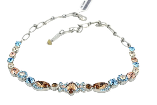 Necklace with multicolored gemstones on a white background