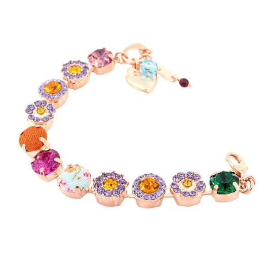 Multicolored gemstone bracelet with heart and flower charms on a white background