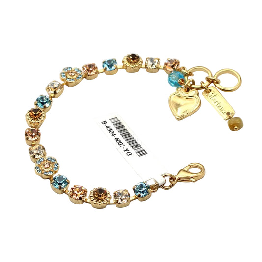 Gold bracelet with colorful beads and charms on a white background