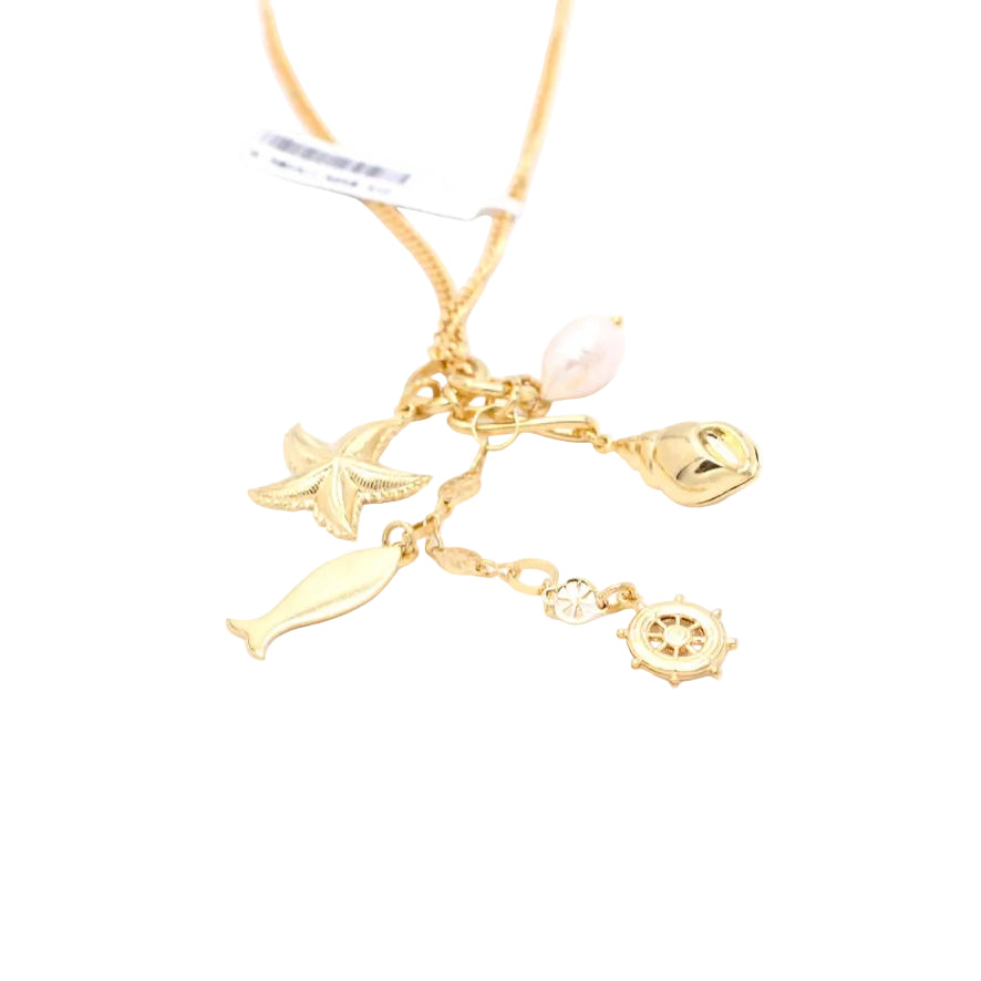 A gold-tone charm necklace featuring nautical-themed charms including a starfish, fish, ship's wheel, and a small bell, with a light pink pearl bead, shown on a white background.