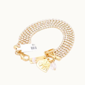 A gold chain bracelet with a small heart charm, shown on a plain white background with its retail tag attached.