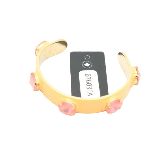 Gold bracelet with pink stones on a white background