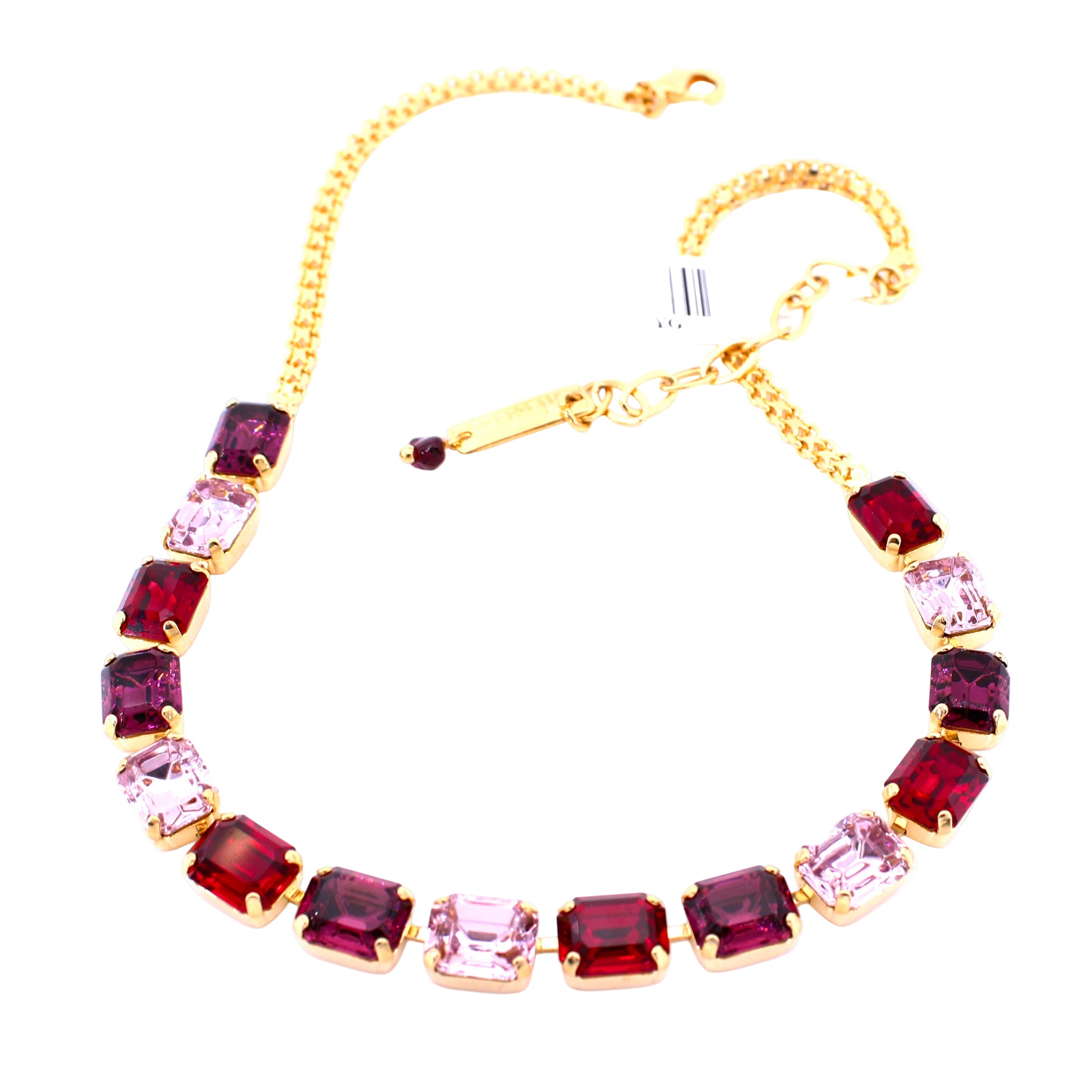 Necklace with red and pink gemstones on a white background