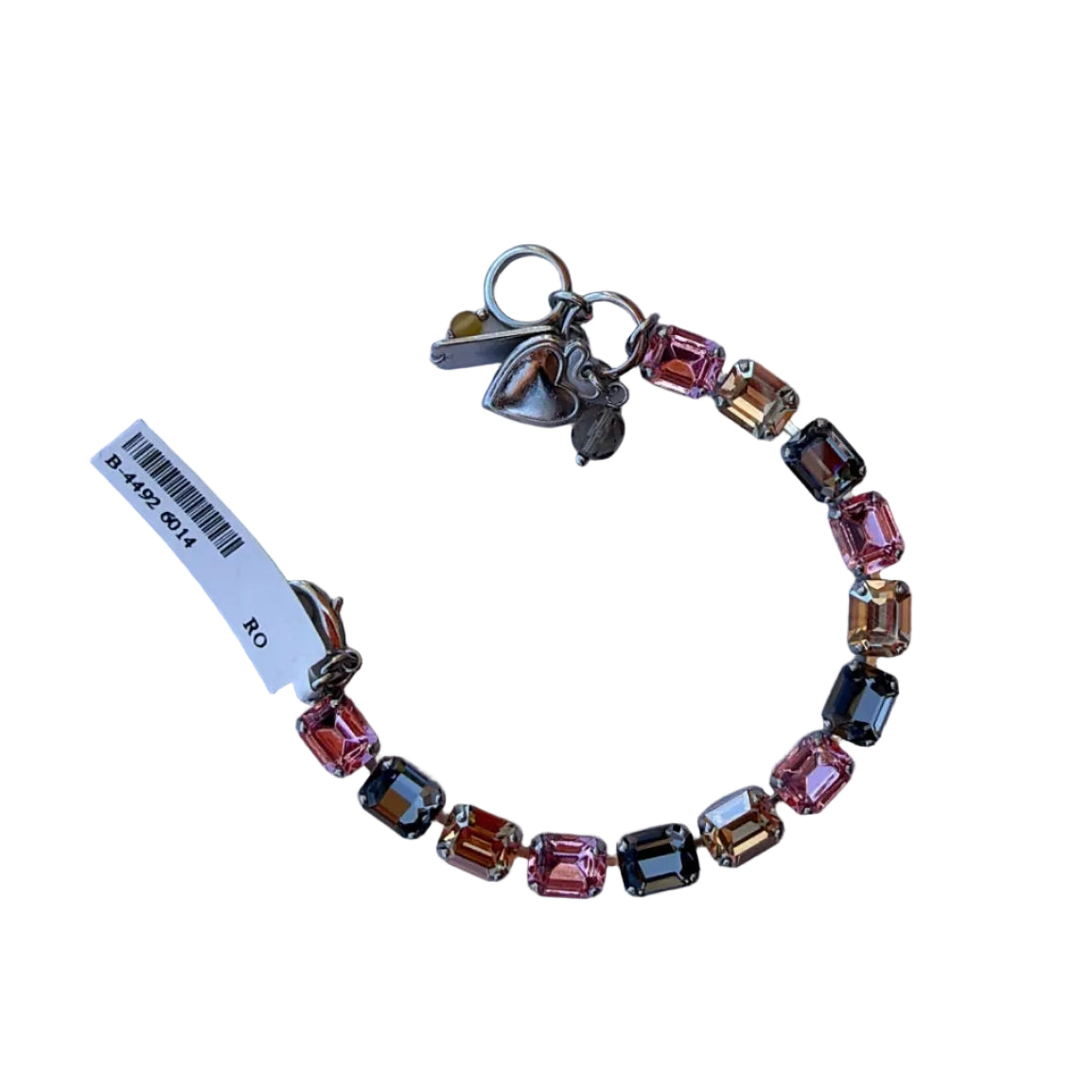 Colorful beaded bracelet with charms on a light purple background