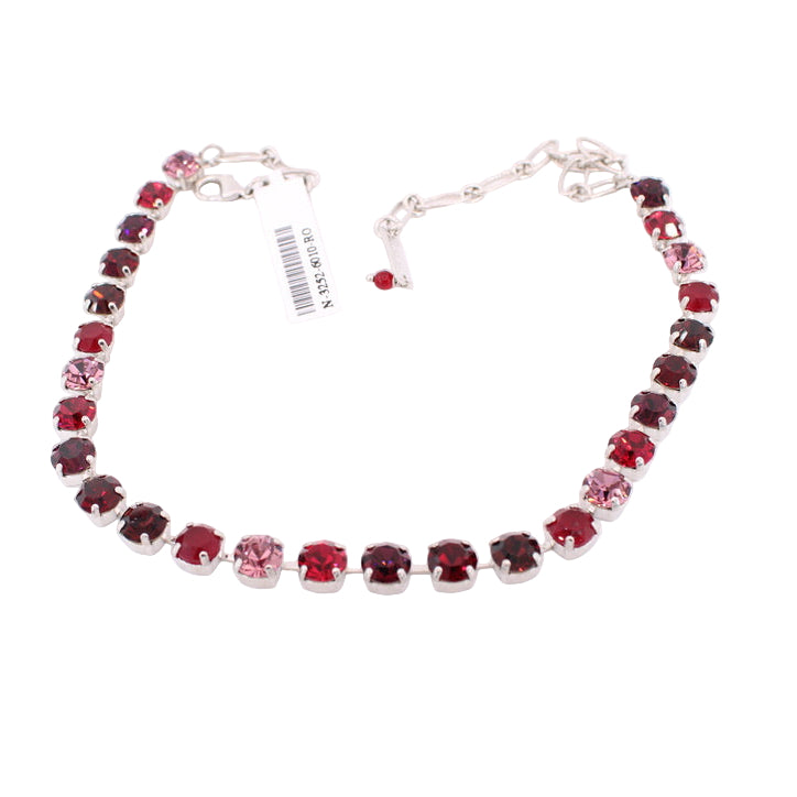 Necklace with red and silver beads on a white background