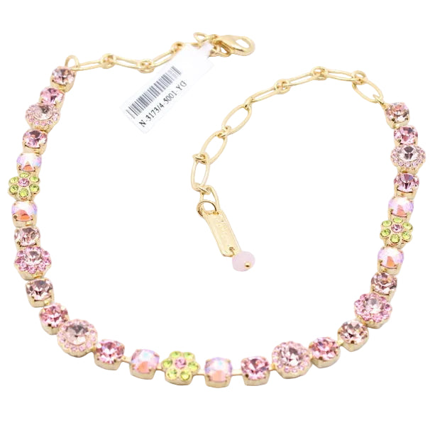 Necklace with pink and yellow beads on a white background