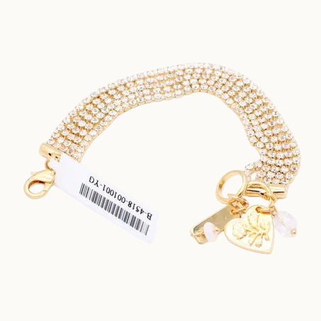 A gold-toned multi-strand chain bracelet with a lobster clasp, a key charm, and a small heart charm, shown on a plain white background with a product tag attached.
