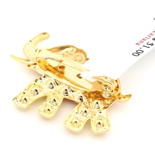 Gold elephant-shaped brooch on a white background