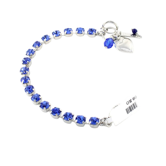Bracelet with blue gemstones and a heart charm on a white background