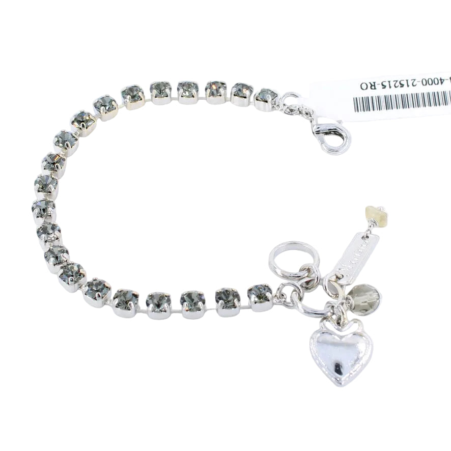 Silver bracelet with heart charm on a white background