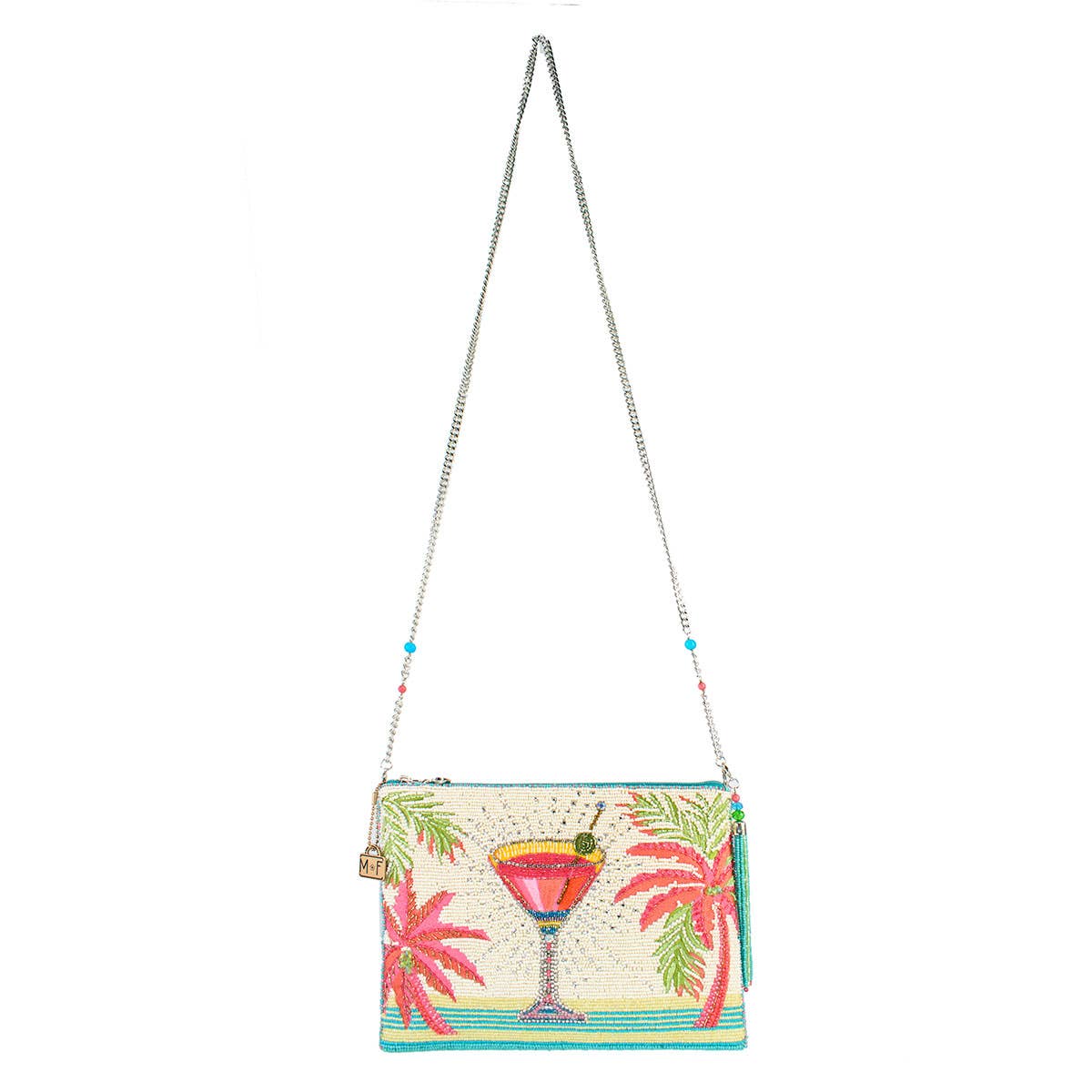 Colorful handbag with palm tree and cocktail design on a white background